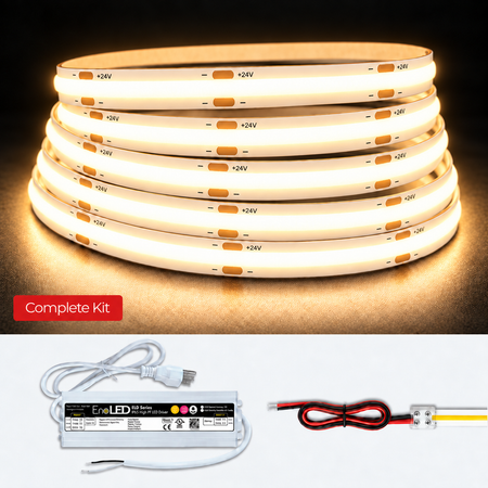 A complete LED light strip kit shown on a white background, featuring a coiled stack of warm white LED strips, a white power supply, and two wire connectors. A red label on the top section reads 'Complete Kit'.