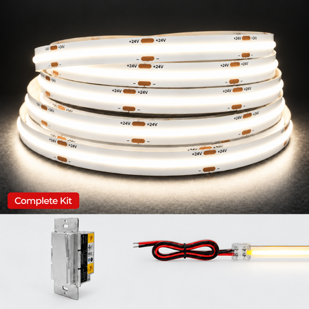 A coiled white LED light strip shown on a dark background, with a red label reading 'Complete Kit' and two smaller product components below: a metal switch module and a red-and-black wire lead with a clear connector. The main product appears to be a lighting kit rather than packaging alone.