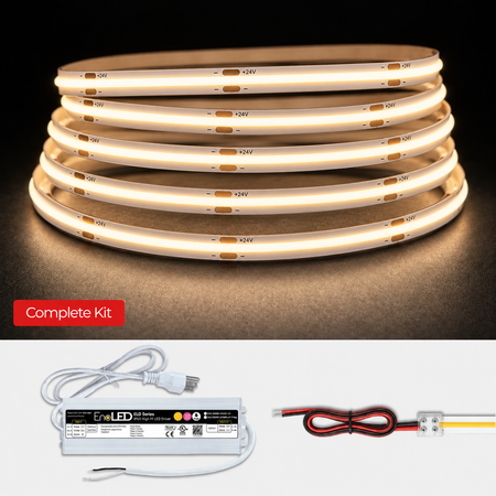 An LED strip light kit shown on a black background, with multiple coiled warm-white illuminated strips above, and the included power supply and wire connectors below. A red label reads 'Complete Kit'.