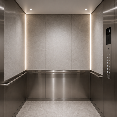 Modern elevator interior featuring recessed warm white LED cove lighting.